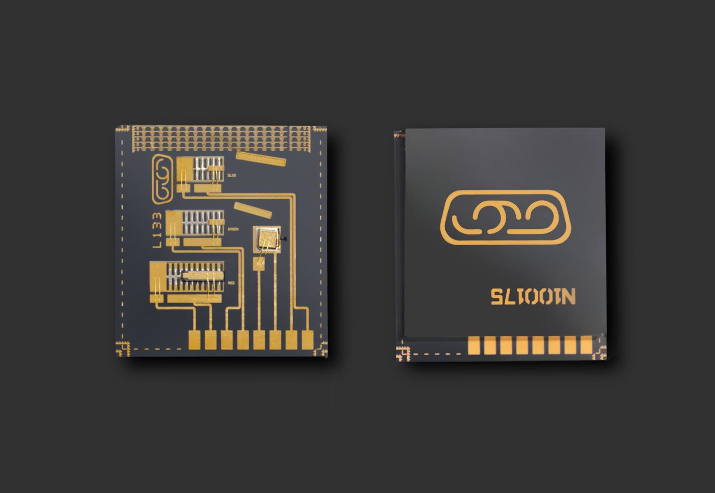 Two square microchips are shown against a dark gray background. The chip on the left features intricate golden circuit traces, pins, and symbols. The chip on the right has a smooth black surface with a large golden emblem and text.